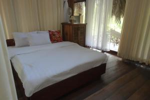 Garden Ville Tiền Giang tesisinde bir odada yatak veya yataklar