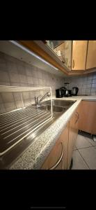 a kitchen with a sink and a counter top at 3 Bed Luxury High End Apartment 5 min walk to Oktoberfest in Munich