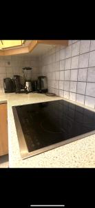a kitchen with a stove and a counter top at 3 Bed Luxury High End Apartment 5 min walk to Oktoberfest in Munich