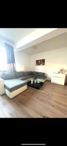 a living room with a bed and a couch at 3 Bed Luxury High End Apartment 5 min walk to Oktoberfest in Munich