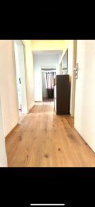 an empty room with a hard wood floor in an apartment at 3 Bed Luxury High End Apartment 5 min walk to Oktoberfest in Munich