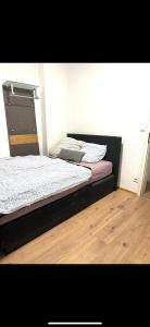 a bedroom with a bed with a laptop on it at 3 Bed Luxury High End Apartment 5 min walk to Oktoberfest in Munich