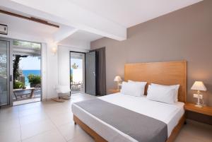 Postel nebo postele na pokoji v ubytování Mare Dei Suites Hotel Ionian Resort + 37 fotografií