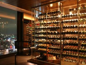 a room with a wall of wine bottles at Shinjuku Prince Hotel in Tokyo