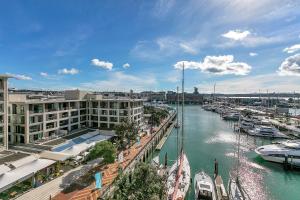 a view of a harbor with boats in the water at Exquisite Sun Soaked Corner Apartment in Auckland