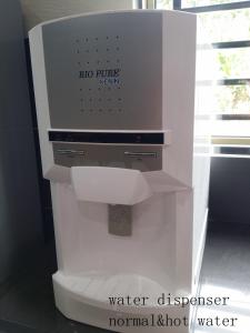 a water dispenser is sitting in a room at Mersing Maple Villa in Mersing