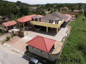 an overhead view of a house with red roof at Mersing Maple Villa in Mersing
