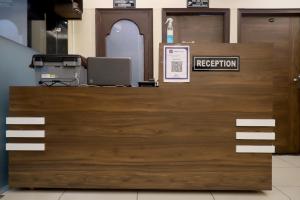 an office door with a registration sign on it at Rk Lodge in Amritsar