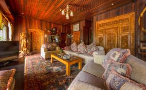 a living room with couches and a table at Onlyou Villas in Amed