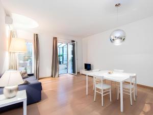 a living room with a couch and a table at The Apartment at Spanish Steps in Rome