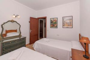 Ein Bett oder Betten in einem Zimmer der Unterkunft Villa Can Jaume by Sealand Villas