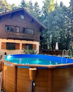 a swimming pool in front of a house at Villa Borovets Mountain & Luxury in Borovets