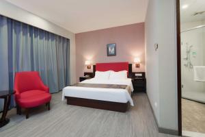 Voodi või voodid majutusasutuse Foshan Guanxin Hotel toas