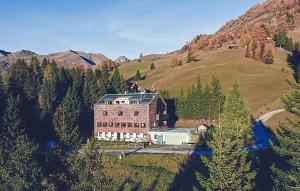 a large building in the middle of a mountain at Wohnung Kreuzjoch 142- Naviser Huette in Navis