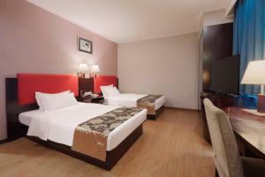 Voodi või voodid majutusasutuse Foshan Guanxin Hotel toas