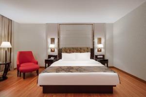 Voodi või voodid majutusasutuse Foshan Guanxin Hotel toas