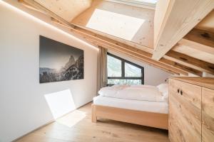 Voodi või voodid majutusasutuse Haus Beta by Zermatt Premium Apartments toas