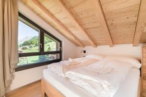 Voodi või voodid majutusasutuse Haus Beta by Zermatt Premium Apartments toas