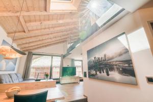 Televiisor ja/või meelelahutuskeskus majutusasutuses Haus Beta by Zermatt Premium Apartments