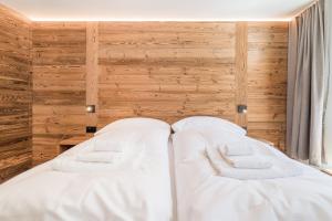 Voodi või voodid majutusasutuse Haus Beta by Zermatt Premium Apartments toas