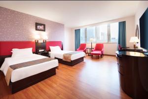 Voodi või voodid majutusasutuse Foshan Guanxin Hotel toas