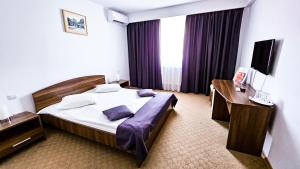 Łóżko lub łóżka w pokoju w obiekcie Hotel Eden