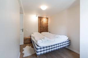 Postel nebo postele na pokoji v ubytování Haus Kirchplatz 4 by Zermatt Premium Apartments