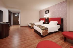 Voodi või voodid majutusasutuse Foshan Guanxin Hotel toas