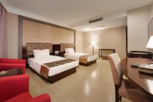 Voodi või voodid majutusasutuse Foshan Guanxin Hotel toas