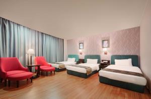 Voodi või voodid majutusasutuse Foshan Guanxin Hotel toas