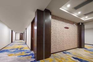 Voodi või voodid majutusasutuse Foshan Guanxin Hotel toas