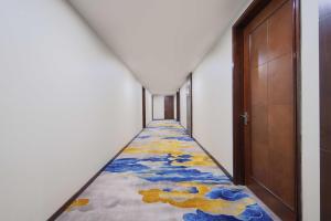 Voodi või voodid majutusasutuse Foshan Guanxin Hotel toas