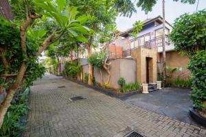 an empty street in front of a house at Canggu Circle Villa by Ini Vie Hospitality in Canggu