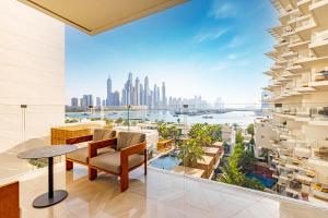 a living room with a view of the city at Five Palm Hotel and Residence - Platinium Dubai in Dubai