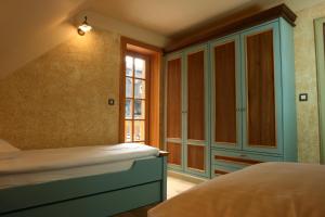 a bedroom with a bed and a window at Villa Les with Hot tub & Sauna in Brežice