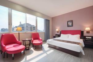 Voodi või voodid majutusasutuse Foshan Guanxin Hotel toas