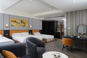 Postel nebo postele na pokoji v ubytování E-DA Skylark Hotel