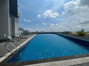 a swimming pool on the roof of a building at Walk to Legoland, Kid Lego Toys, D'Pristine Medini in Nusajaya