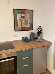 a kitchen with a counter top with a coffee maker on it at Außergewöhnliches Apartment in bester Lage in Biberach an der Riß