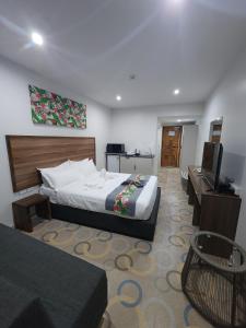 Postel nebo postele na pokoji v ubytování Vualiku Hotel & Apartments + 17 fotografií