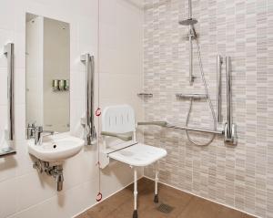 a bathroom with a sink and a shower at Hampton by Hilton Oxford in Oxford