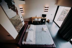 a room with a couch and a table and a desk at Agriturismo Opera 02 in Castelvetro di Modena