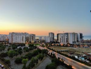 a city with tall buildings and a street at sunset at Tangier Center Free Parking in Tangier