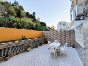 a patio with a table and chairs on a balcony at Tangier Center Free Parking in Tangier
