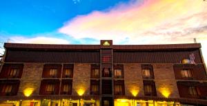 a building with a clock on the top of it at Hotel S R Castle in Port Blair