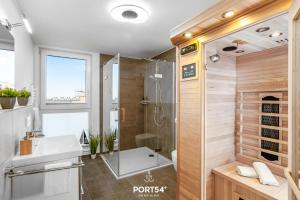 a bathroom with a shower and a sink at Hafen Loft in Olpenitz