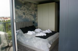 En eller flere senge i et værelse på WESTIN HOUSE RESORT Apart NO 407