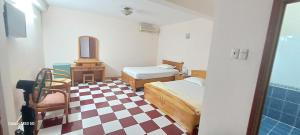 Ένα ή περισσότερα κρεβάτια σε δωμάτιο στο Nhat Binh 2 Hotel