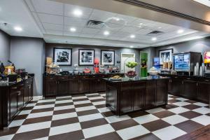 a hair salon with a checkered floor at Hampton Inn Statesboro in Statesboro