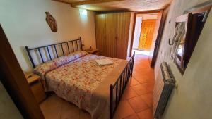 A bed or beds in a room at Spicchio di Luna - Casa Vacanze